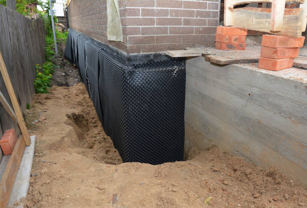 Happy homeowners after waterproofing job in Fennville